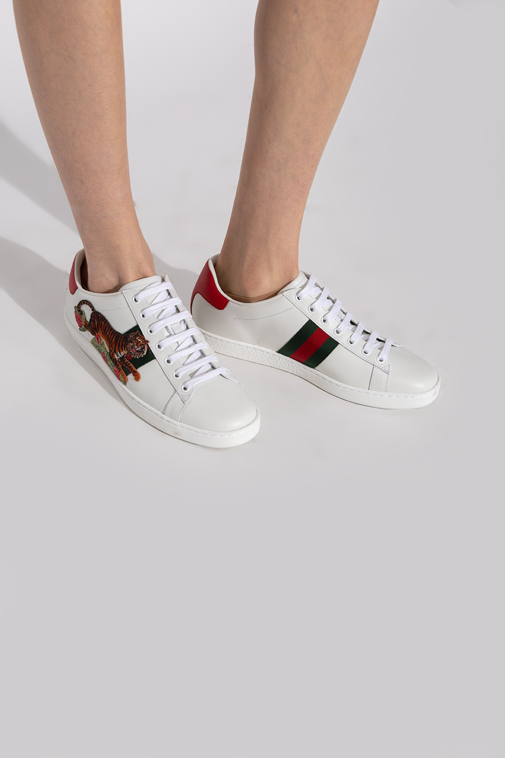 Gucci tiger sneakers deals